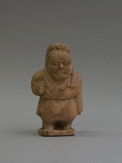 Terracotta dwarf with slight remains of celadon...