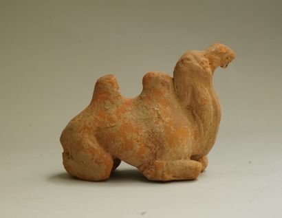 Small orange-beige terracotta reclining camel....