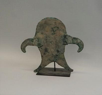 Idol made of a thick bronze blade representing...