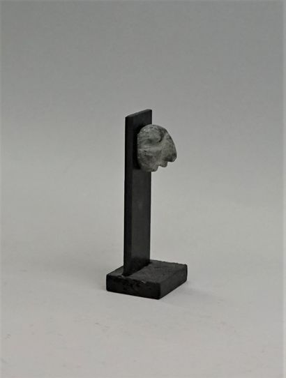 Stylized face with a prominent nose. Green...