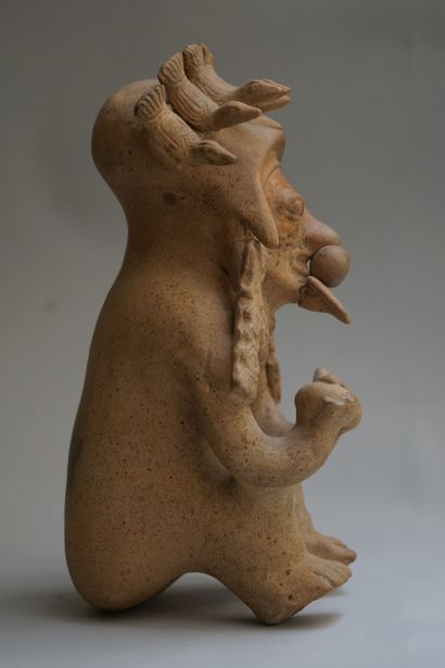 Anthropomorphic figure showing a seated high...
