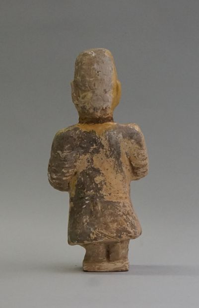Terracotta dwarf with remnants of lime glaze...