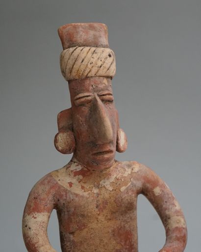 Anthropomorphic sculpture of a seated figure...