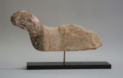 Stylized bird in carved stone with remains...
