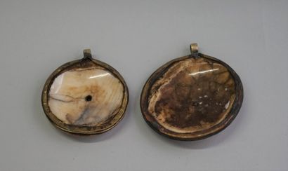 Two old medallions made of skull bones and...