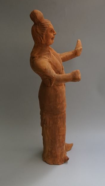 Lokapala made of orange-coloured terracotta....