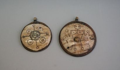 Two old medallions made of skull bones and...
