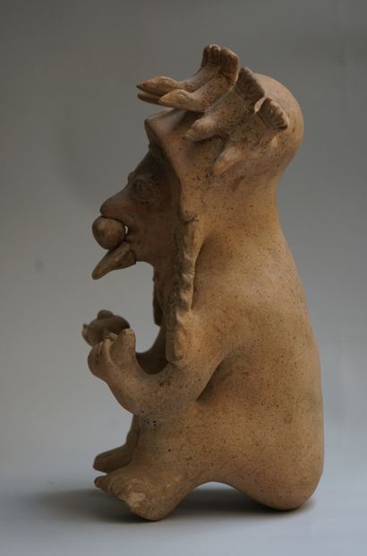 Anthropomorphic figure showing a seated high...