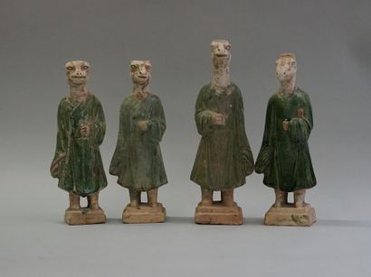 Twelve figures of a procession with heads...