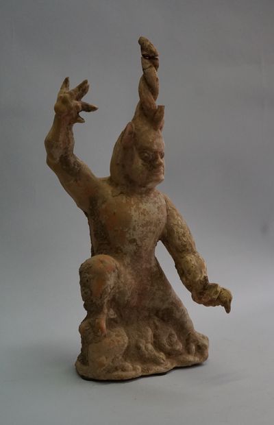 Beige and white terracotta one-horned chimera....