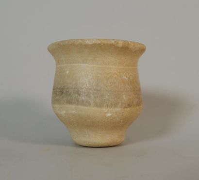 Calcite pot with globular body, flared lip...