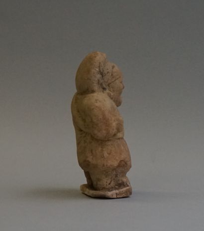 Terracotta dwarf with slight remains of celadon...