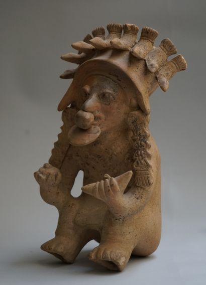 Anthropomorphic figure showing a seated high...