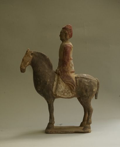 Beige terracotta rider with black, white...