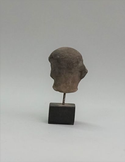 Jaguar head in grey terracotta. It has two...