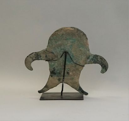 Idol made of a thick bronze blade representing...
