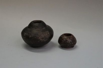 Two ovoid and shamanic vessels. Terracotta....