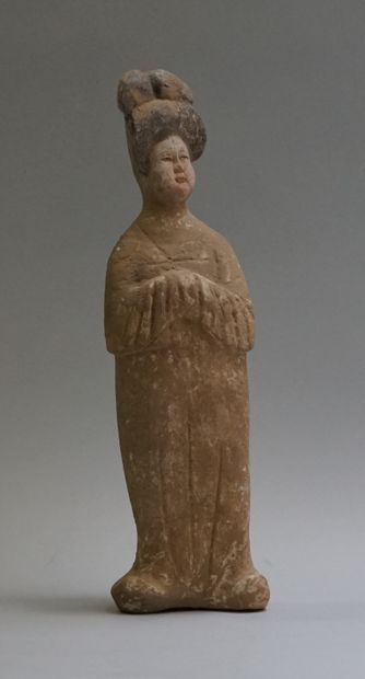 A standing beige terracotta 