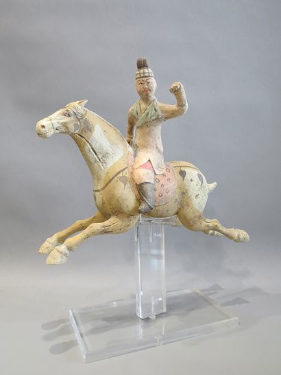 
Polo player riding his mount in a jump....
