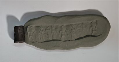 Seal in matte hematite decorated with figures...