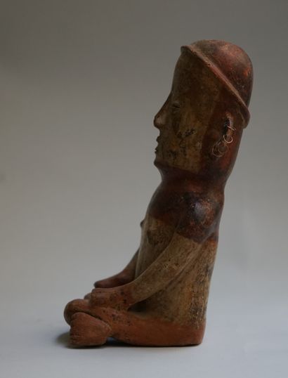 Anthropomorphic figure of a seated woman...