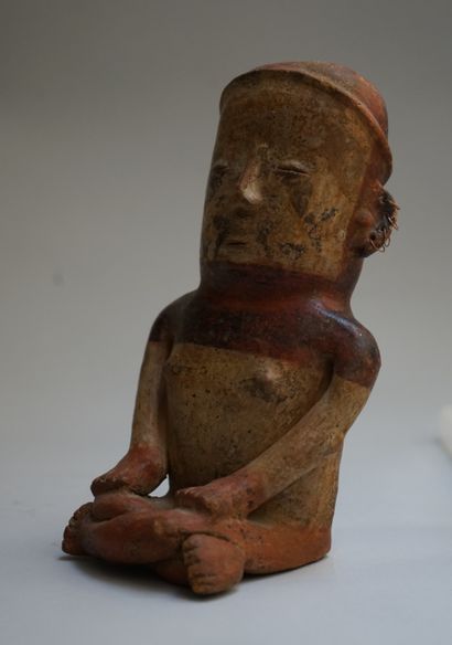 Anthropomorphic figure of a seated woman...