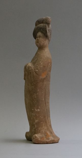 A standing beige terracotta 