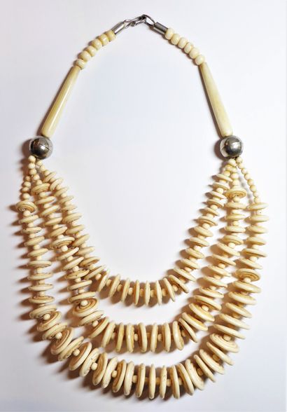 NECKLACE with 3 rows of bone pearls, composed...