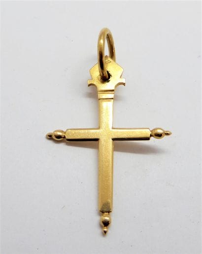 CROSS PENDANT in 18K (750/°°) yellow gold,...
