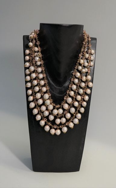 3 rows of gold metal necklace with iridescent...