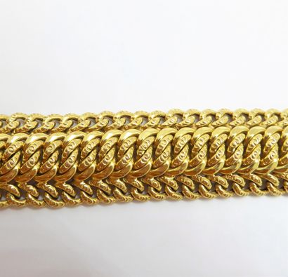 BRACELET in 18K (750/°°) yellow gold. Ratchet...
