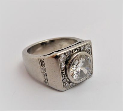 A platinum ring in the form of a signet ring,...