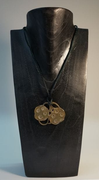 Blond horn pendant with two fruits. Circa...