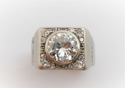 A platinum ring in the form of a signet ring,...
