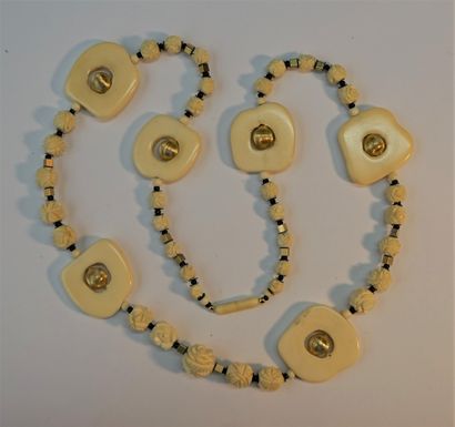 NECKLACE made of carved bone beads in the...