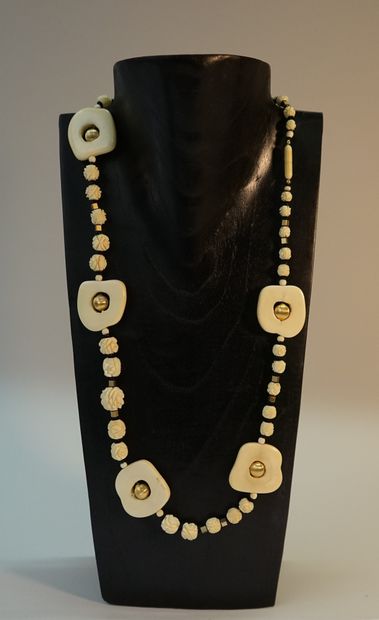 NECKLACE made of carved bone beads in the...