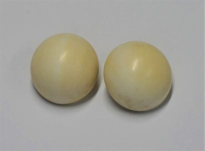 Pair of round ivory cabochon ear clips, metal...