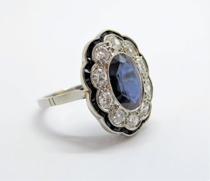 Platinum Pompadour ring centered on an oval...