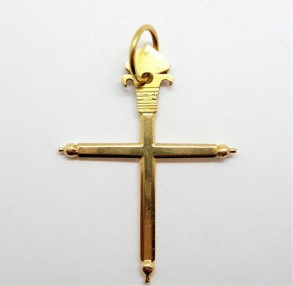 CROSS PENDANT in 18K (750/°°) yellow gold,...