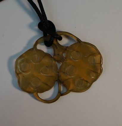 Blond horn pendant with two fruits. Circa...
