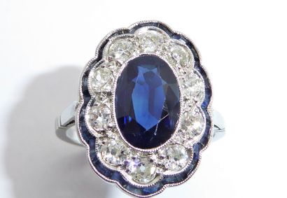 Platinum Pompadour ring centered on an oval...