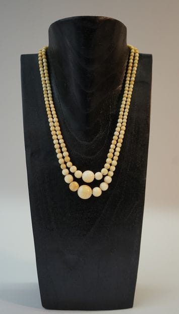 NECKLACE, double row of falling ivory balls....