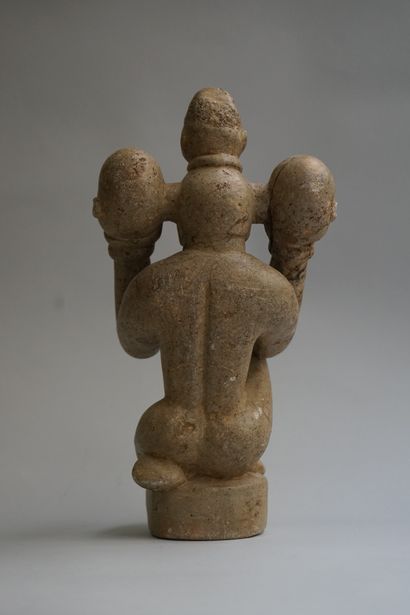 Anthropomorphic figure showing a kneeling...