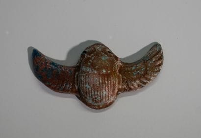 Amulet in the form of a winged beetle. Terracotta...