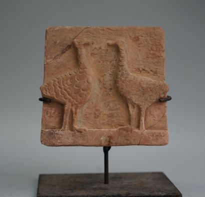 Terracotta plaque representing two geese...