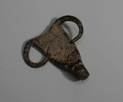 Brown bronze zoomorphic idol head representing...