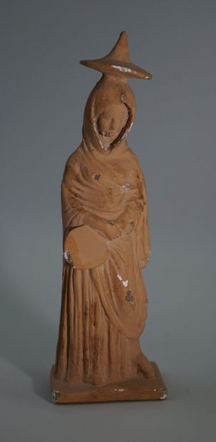 Statuette representing a draped woman.

Greek...