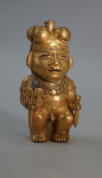 Statuette of a dignitary in very low gold....