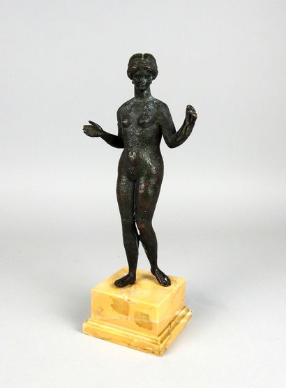 Very large statuette representing Venus holding...