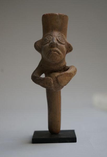 Whistle with a busted figure holding a ball....